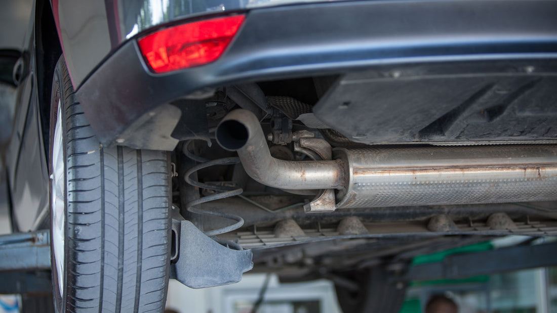 Closeup shot of a car parked in an automobile repair shop.